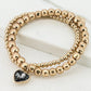 Envy Gold Bead Bracelet with Black Heart Charm