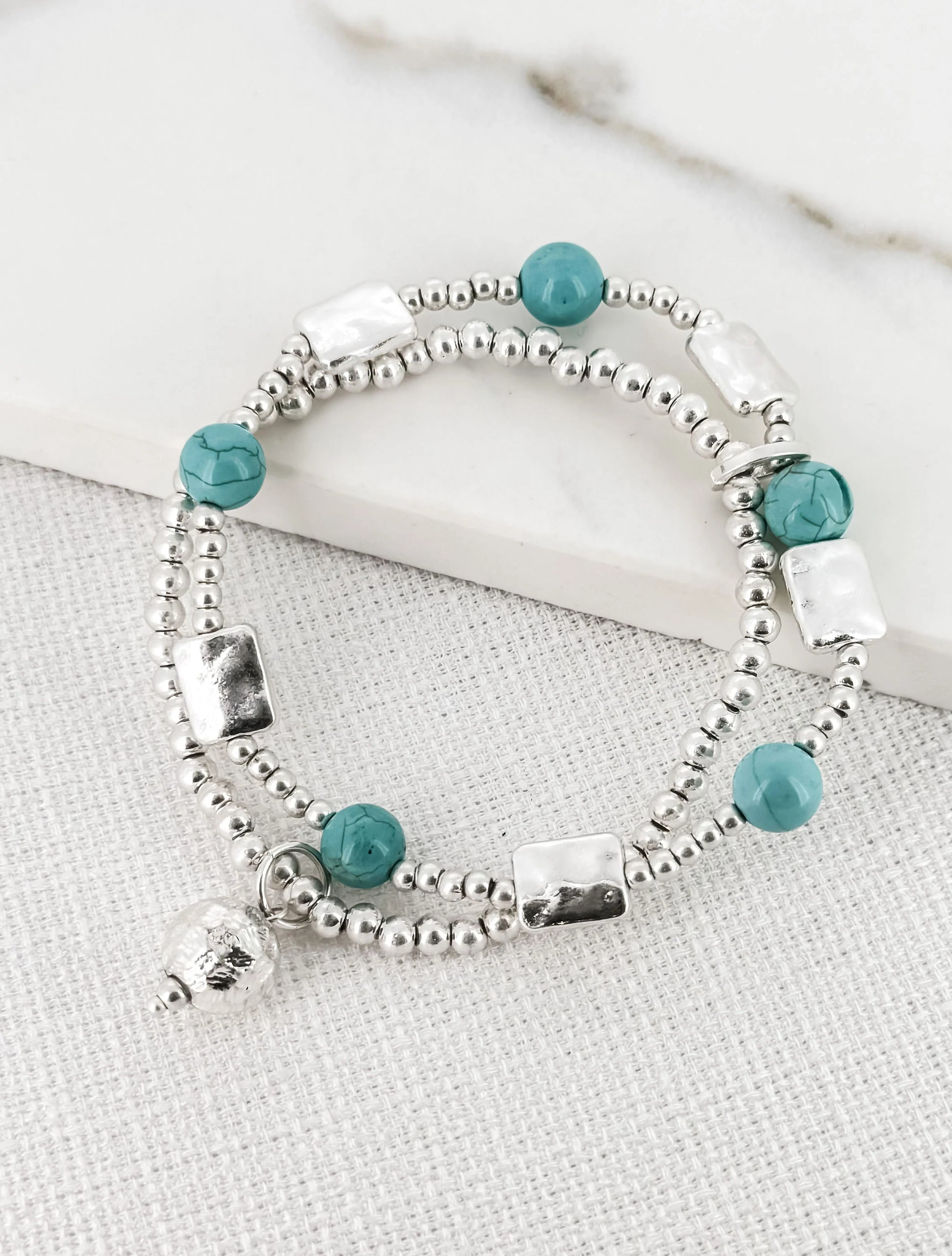 Envy Double Layer Silver and Turquoise Bead Bracelet with a Ball Charm