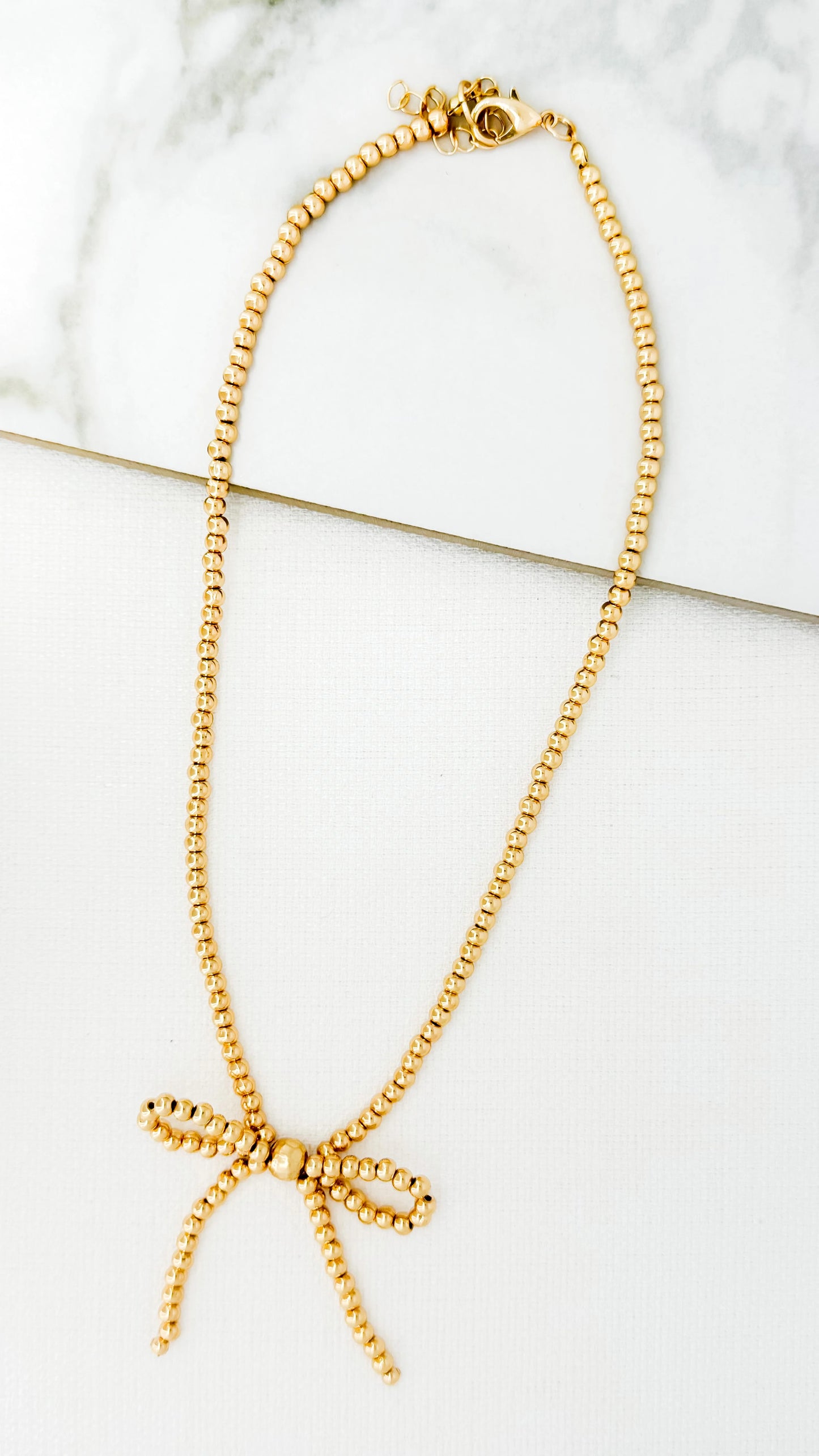 Envy Short Gold Bow Necklace