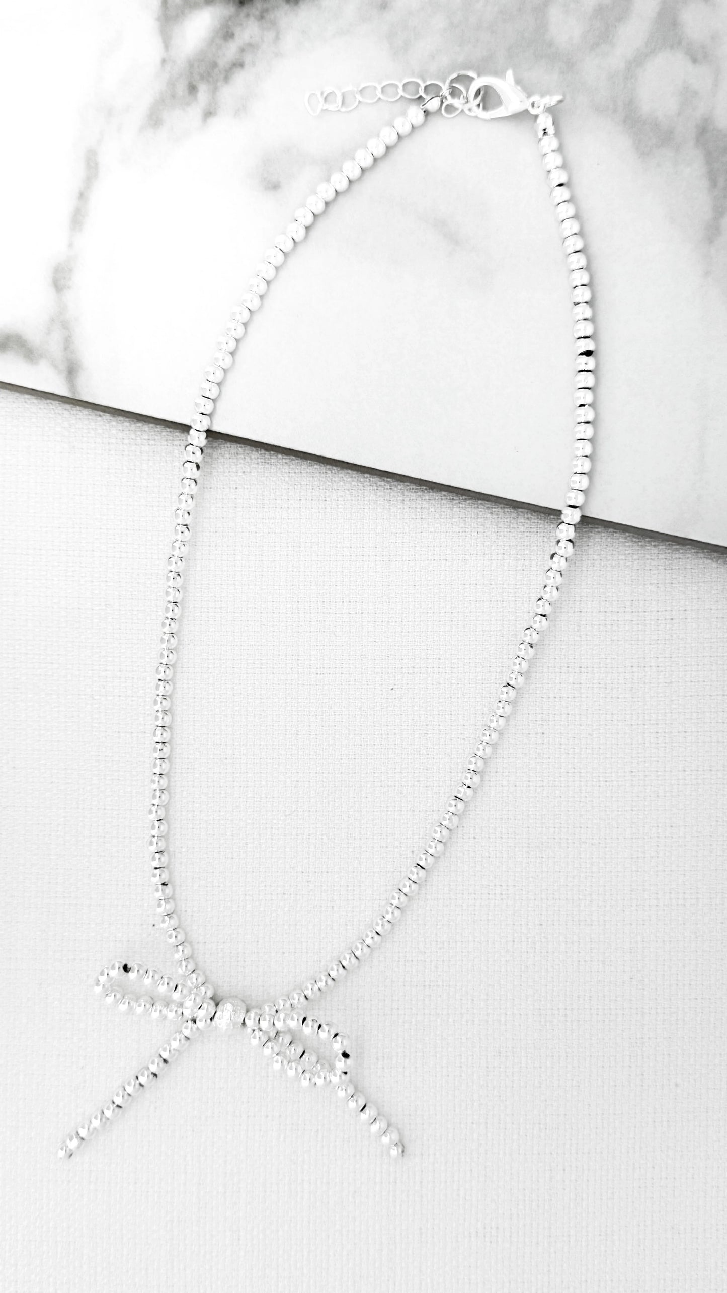 Envy Short Silver Bow Necklace