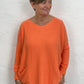 Orange long slouchy jumper with front pockets