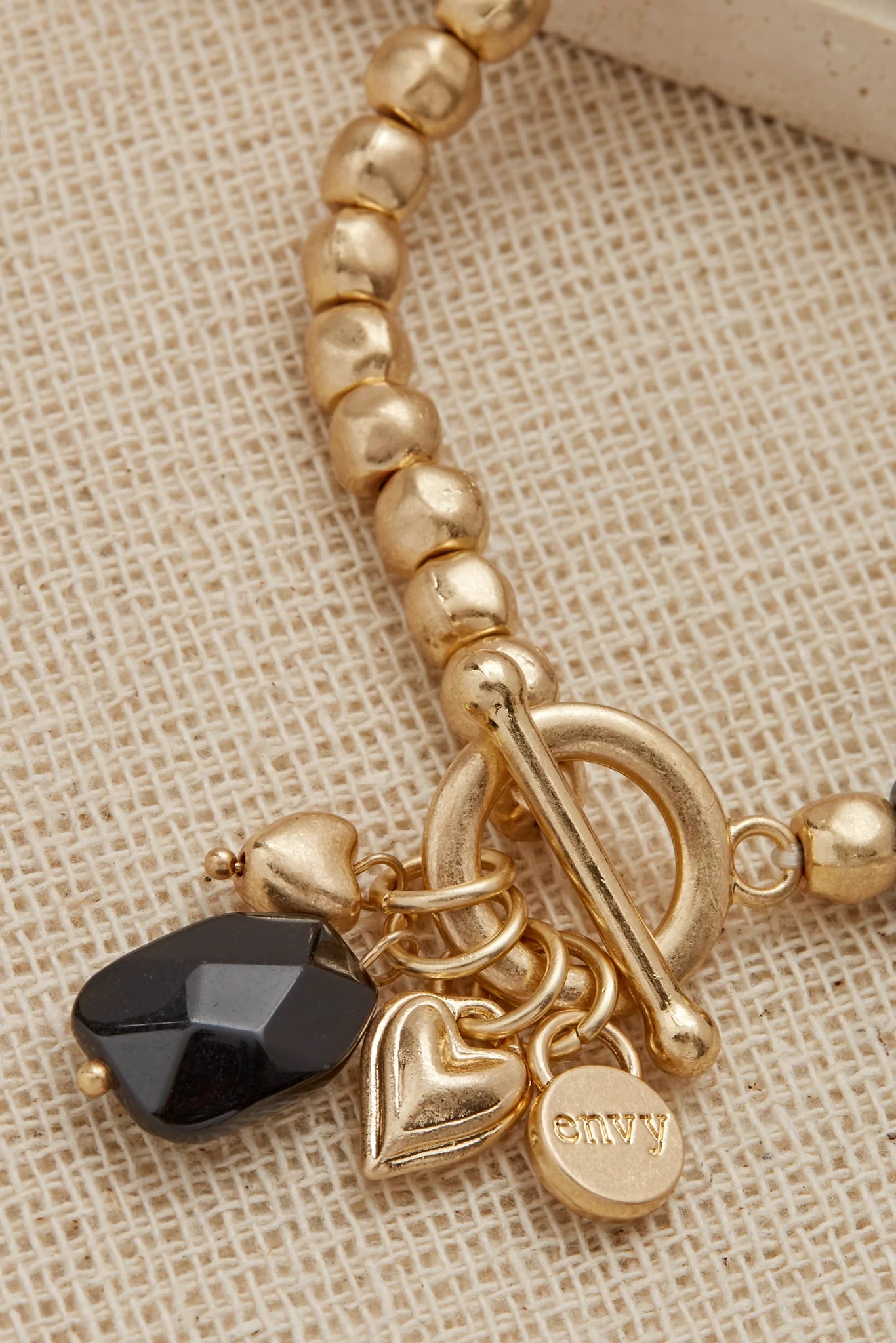 Envy Gold and Black Bead Stretch Bracelet with T Bar Clasp Detail