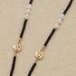 Envy long black, gold and pearl beaded necklace